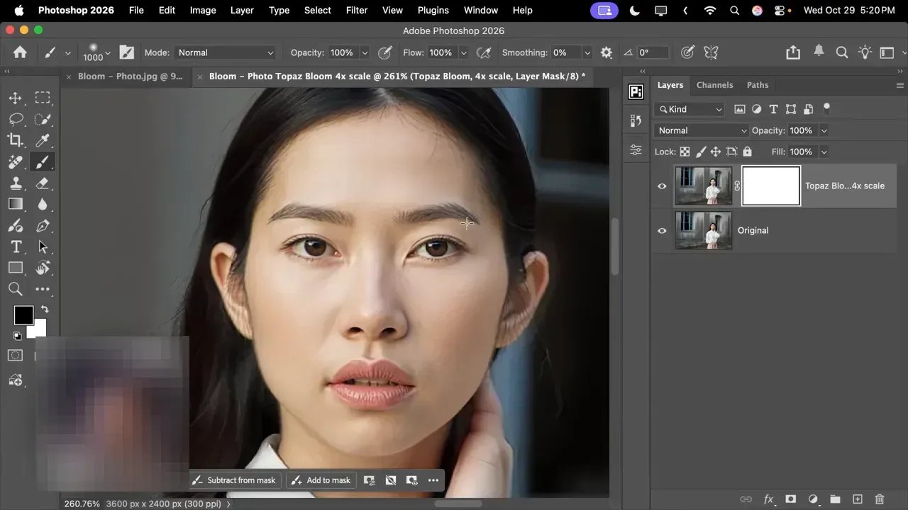 Close-up in Photoshop of a portrait upscaled with Topaz Bloom 4x, showing fine facial detail and the Topaz Bloom layer selected.